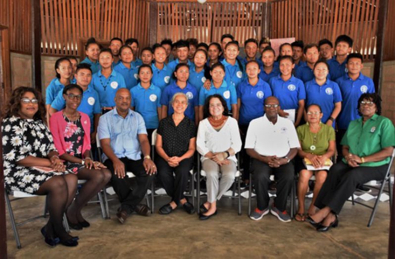 First Lady, Mrs. Sandra Granger (seated, fourth from right), Principal of the Bina Hill Institute, Dr. Laureen Pierre (seated, fifth from right), Regional Executive Officer, Mr. Carl Parker (seated third from left) along with the facilitators of the BIT-ICT training.  The participants are pictured standing.