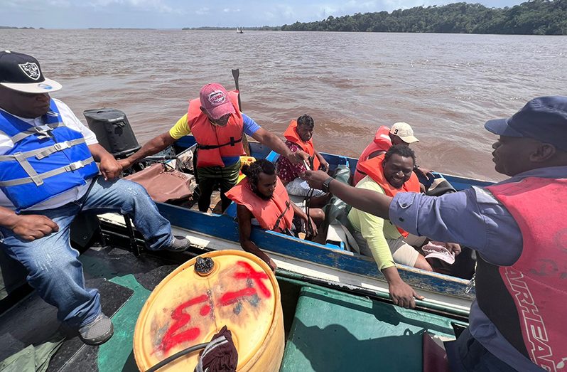 A team of MARAD officials and Coast Guard officers conducted an exercise in the Essequibo and Mazaruni Rivers during which documents were checked to ensure that those operating the vessels were following the law (MARAD photos)