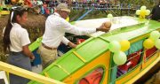 President David Granger pours coconut water on the newly commissioned boat