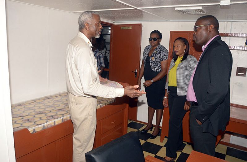 From right, Minister of Public Infrastructure (MoPI) David Patterson; Transport & Harbours Department (T&HD,) General Manager Ms. Mercelene Merchant; Minister within the Ministry of Communities, Annette Ferguson; and Managing Director of the Courtney Benn Contracting Services, Courtney Benn, in discussion onboard the boat (Adrian Narine photo)