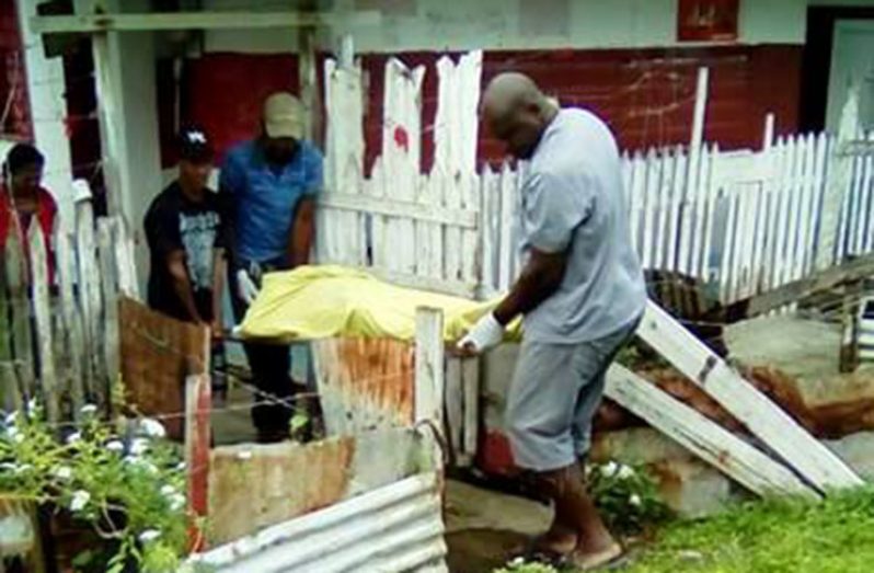 Undertakers removing the lifeless body of Wilfred Mangra from his Rosignol home on Saturday