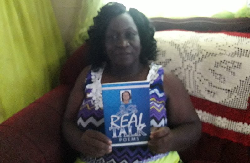 Janice Carmichael with her unpublished book of poetry called "Real Talk”