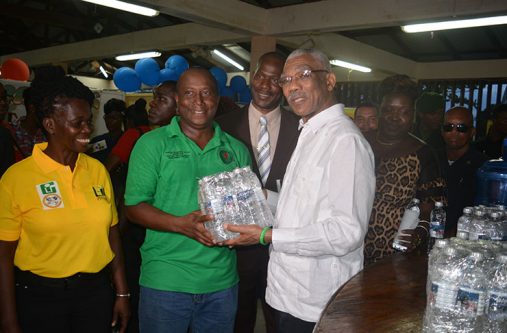 booth-2-Granger President David Granger with a young entrepreneur and his product