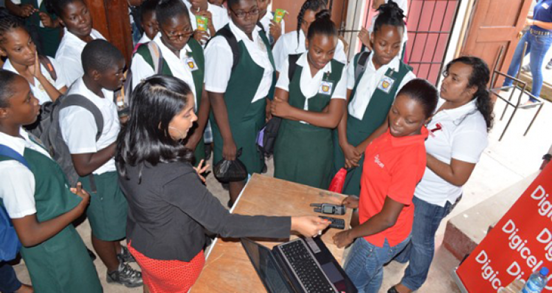 Students visiting the Digicel booth at the event