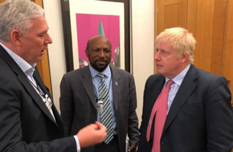 St. Lucia Prime Minister Allen Chastanet (left) and Britain’s Prime Minister Boris Johnson (Right) in conversation