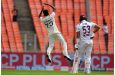Mohammed Siraj leaps in celebration after bowling Brandon King (Associated Press)
