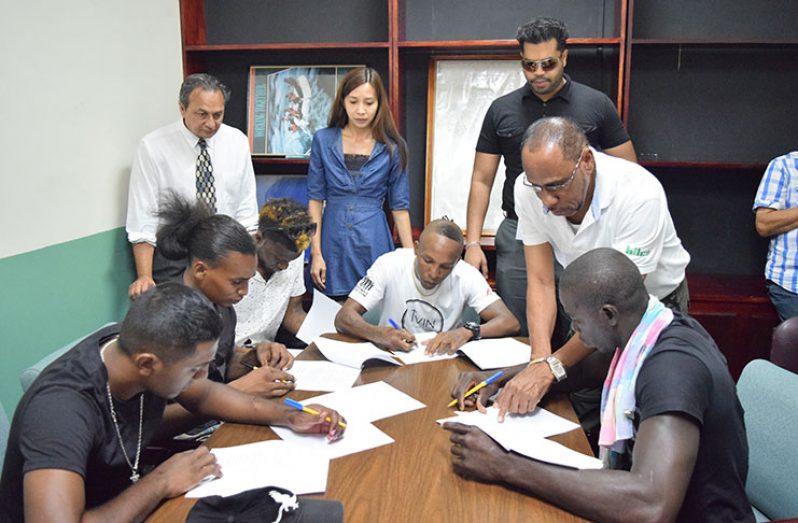 Boxers for the GBBC’s `locked and loaded’ card scheduled for the Giftland Mall on April 9 put their signatures to contracts yesterday in the presence of GBBC and Giftland Mall officials (Photo by Cullen Bess-Nelson).