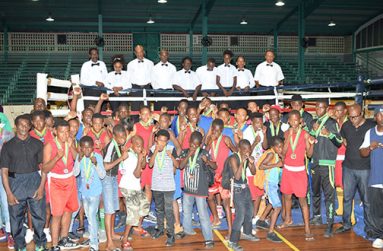 The young boxers with their coaches and the officials pose for a Cullen Bess-Nelson photo on Saturday night.
