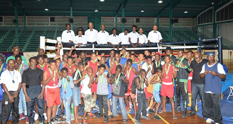 The young boxers with their coaches and the officials pose for a Cullen Bess-Nelson photo on Saturday night.