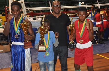 GBA’s president Steve Ninvalle (second right) strikes a pose with the best boxers of the three categories contested in the Tri-Nations Schoolboys and Juniors boxing championships.From left: St. Lucia’s Nathan Ferirre, Omar Pollard for Juniors and Shaquiel for Schoolboys.