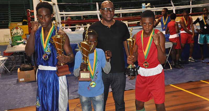 GBA’s president Steve Ninvalle (second right) strikes a pose with the best boxers of the three categories contested in the Tri-Nations Schoolboys and Juniors boxing championships.From left: St. Lucia’s Nathan Ferirre, Omar Pollard for Juniors and Shaquiel for Schoolboys.