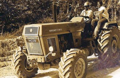 Hitching a ride to Yukuriba Falls on a Demerara Woods (now Demerara Timbers)
tractor.