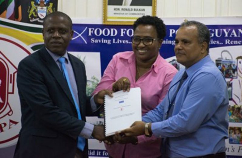 CH&PA’s Chief Executive Officer, Lelon Saul [left]; Minister within the Ministry of Communities with responsibility for Housing, Annette Ferguson [centre], and Chief Executive Officer of FFTP, Kent Vincent, presenting the signed MoU for the project