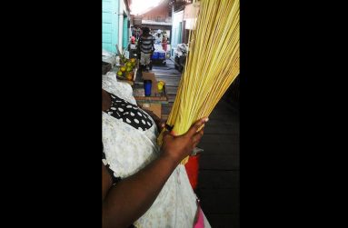 Irene Kingston prefers not to show her face as she replenishes her stock to go again