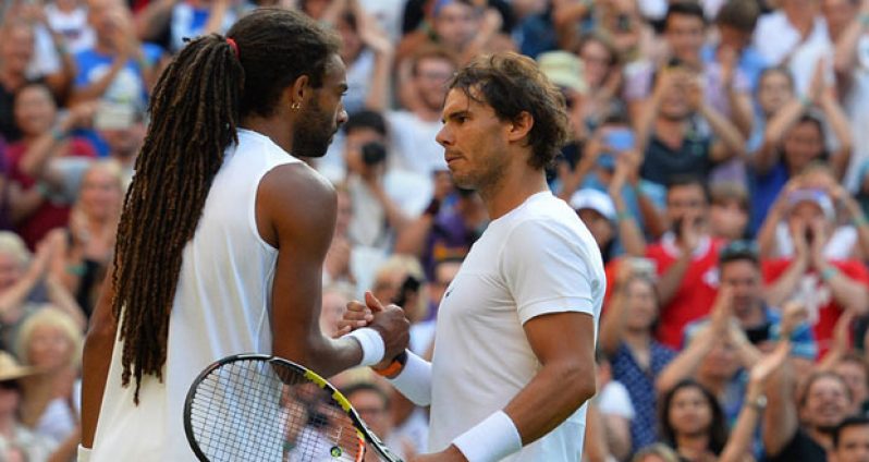 Dustin Brown (left) is congratulated by Rafael Nadal following his win over him in Wimbledon 2015.