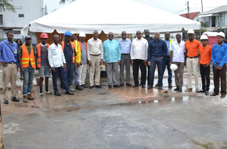 Minister of Finance Winston Jordan and the team at the building site
