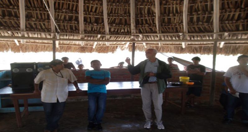 Communities Minister Ronald Bulkan speaking to residents of Monkey Mountain