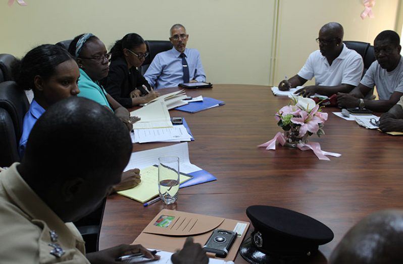 Minister of Business, Dominic Gaskin in discussion with minibus operators and their union leaders