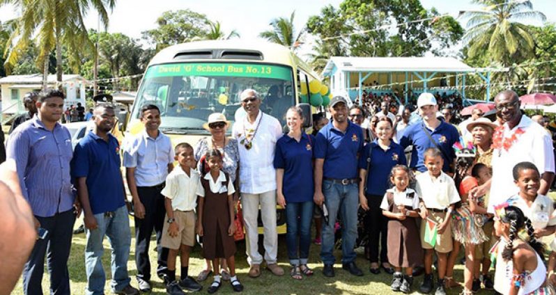 President David Granger and Minister of Social Cohesion, Ms Amna Ally are surrounded by students and representatives of Innovative Mining Incorporated. Donor, Mr Joe Jagmohan, is standing third from left and Regional Executive Officer, Mr Rupert Hopkinson, is at right.