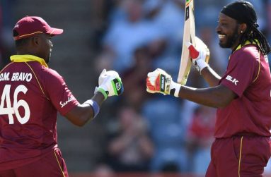 Chris Gayle (right) is congratulated by Darren Bravo after reaching his 25th ODI hundred on Wednesday against England.