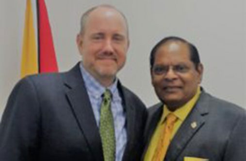 Prime Minister Moses Nagamootoo and Jason Calder, Country Representative of the Carter Center