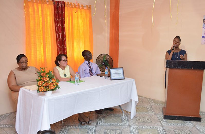 First Lady, Mrs. Sandra Granger seated at the head table, is flanked by Pan American Health Organisation/ World Health Organisation (PAHO/WHO) Representative, Dr. William Adu-Krow and representative of the Ministry of Public Health, Dr. Ruth Williams
