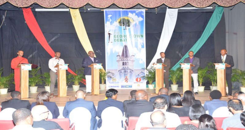 The candidates contesting for seats in Geogetown at their podium just before the debate began (Delano Williams photo)