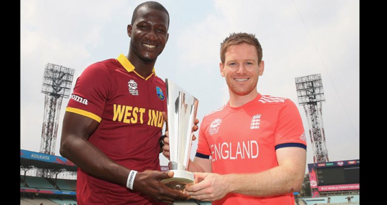 Darren Sammy and Eoin Morgan with the World T20 trophy in Kolkata, yesterday. (ESPN Cricinfo photo)