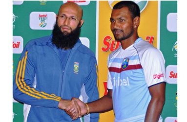 Hashim Amla and Denesh Ramdin shake hands during a media briefing in  Centurion, yesterday.