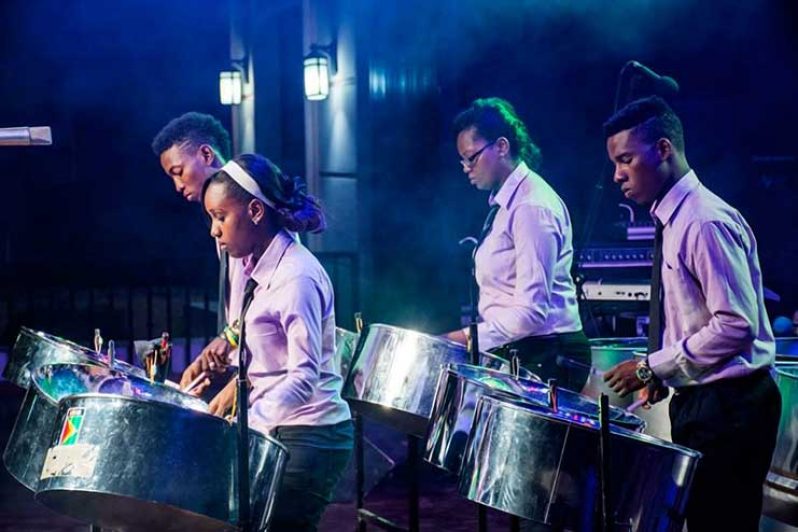 Dexter Dey with
Guyana’s National
Steel Orchestra on
stage at CARIFESTA
in Haiti 2015