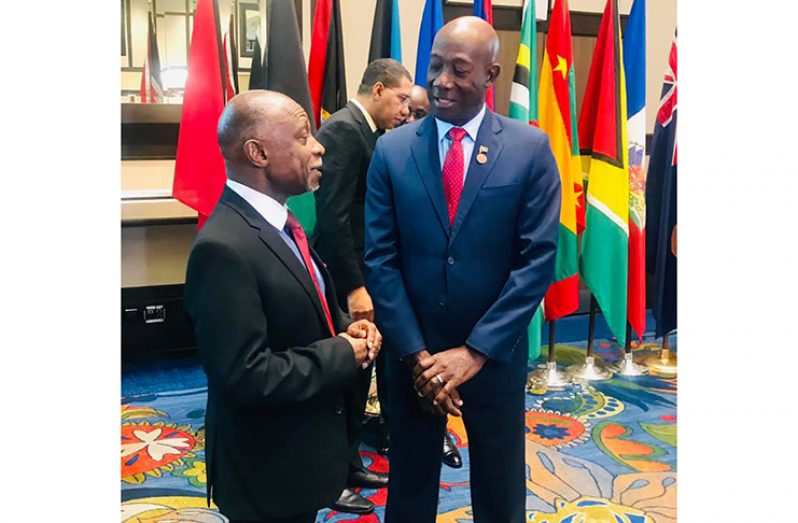 Vice President and Minister of Foreign Affairs, Carl Greenidge shares a light moment with Prime Minister of Trinidad and Tobago, Dr. Keith Rowley on the sidelines of the 18th Special Meeting of the Conference of Heads of Government of the Caribbean Community on the Single Market and Economy