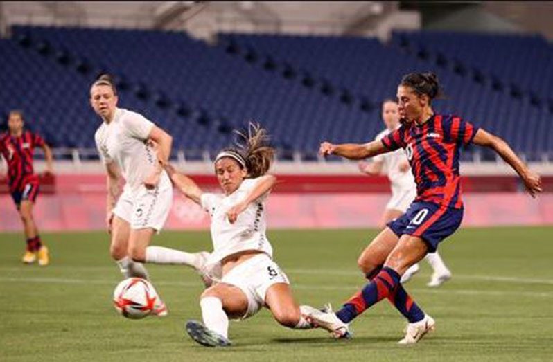 Tokyo 2020 Olympics - Soccer Football - Women - Group G - New Zealand v United States - Saitama Stadium, Saitama, Japan - . Carli Lloyd of the United States shoots at goal REUTERS/Molly Darlington