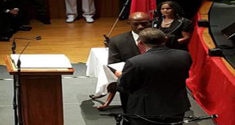 President Anthony Carmona presents the instrument of appointment to Prime Minister Dr Keith Rowley after he took his oath of office Wednesday Photo courtesy CNC3