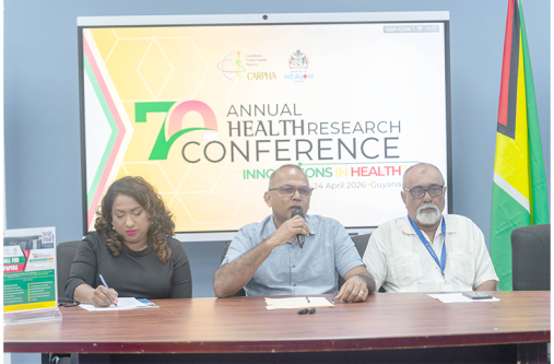 Minister of Health, Dr. Frank Anthony (centre) and Executive Director of CARPHA, Dr. Lisa Indar (left) (Delano Williams photo)