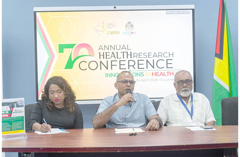 Minister of Health, Dr. Frank Anthony (centre) and Executive Director of CARPHA, Dr. Lisa Indar (left) (Delano Williams photo)