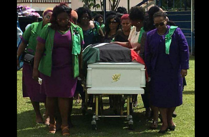 Members of the National Congress of Women led by Chairman Volda Lawrence bearing the casket of their comrade Sandra Adams