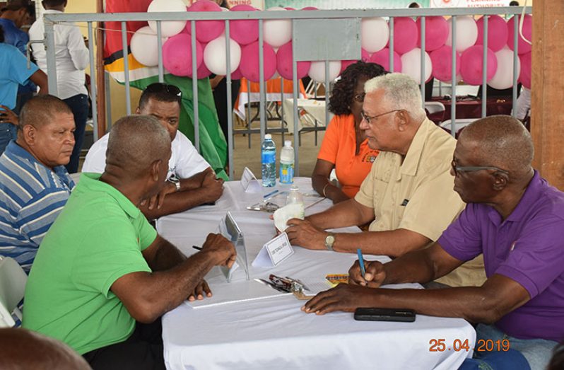 Satisfied cash crop farmers representative, Mr. Peter De La Cruz, at extreme left [wearing blue striped shirt] during the interaction with the Minister of Agriculture, GUYSUCO and the MMA