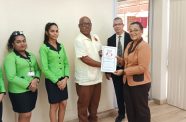 Staff of Hand-in-Hand Group of Companies with a representative of CCWU following the signing of the agreement (CCWU photo)