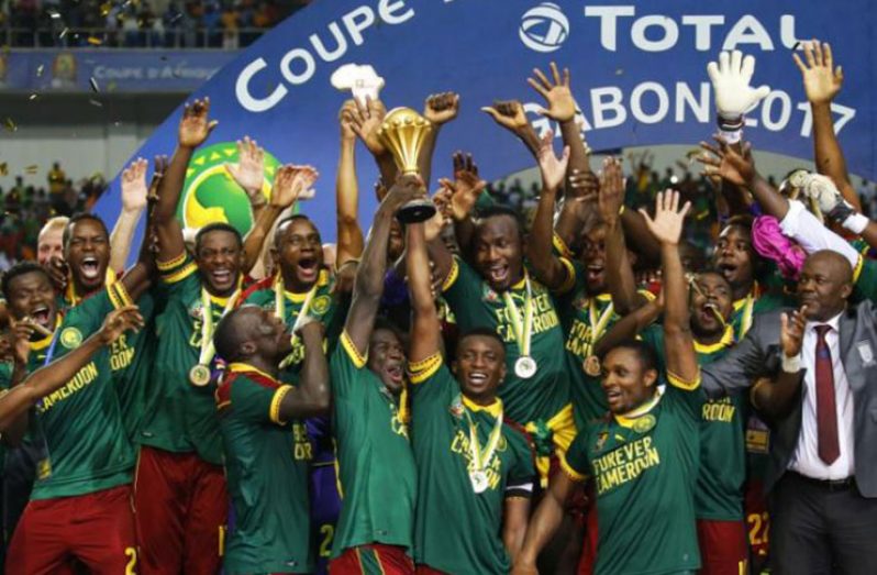 Cameroon's Benjamin Moukandjo celebrates with the trophy and teammates after winning the African Cup of Nations Reuters / Mike Hutchings Livepic