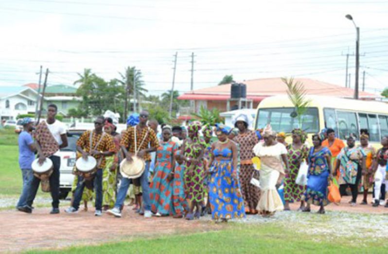 Ghana Day Queens and Courts being escorted to Congress Place by African drummers