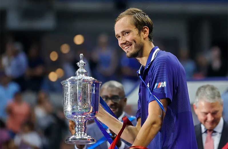Daniil Medvedev of Russia celebrates with the championship trophy after defeating Novak Djokovic of Serbia to win the Men’s Singles final match on Day Fourteen of the 2021 US Open at the USTA Billie Jean King National Tennis Center on Sunday ( Photo by Sarah Stier/Getty Images)