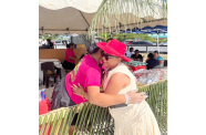 Director-General Ministry of Amerindian Affairs Sonia Latchman warmly embraces a resident during the Heritage Day celebration