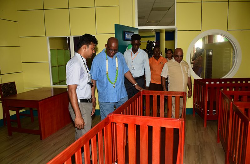 Finance Minister Winston Jordan (second left) and Region Three Regional Executive Officer (REO) Denis Jaikaran (first right) and other officials inspecting some of the equipment at the centre during a tour of the facility (Adrian Narine photo)