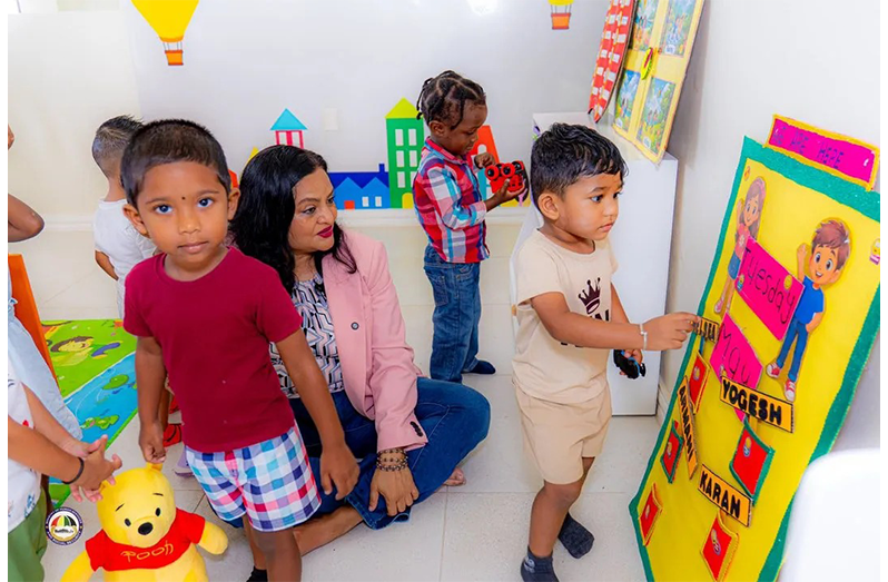 Minister of Human Services and Social Security, Dr Vindhya Persaud, interacts with children of the Anna Catherina Early Childhood Development Centre