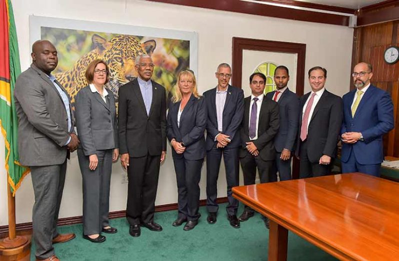 President David Granger and Minister of Business, Dominic Gaskin with the executive members of the American Chamber of Commerce