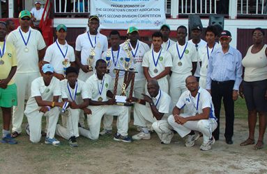 The winning DCC team pose with representatives of the sponsors