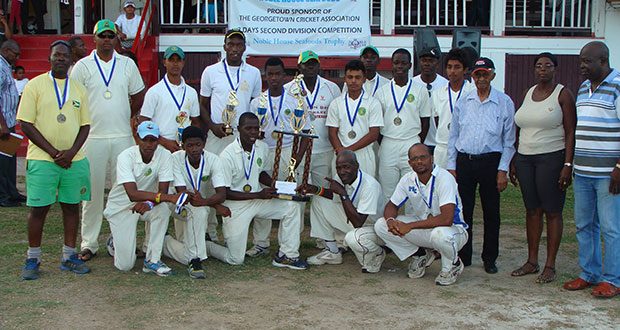 The winning DCC team pose with representatives of the sponsors
