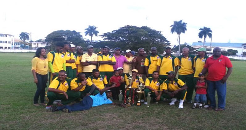 The victorious Regal Masters Over-35 and Open teams, strike a pose with their spoils and supporters at the completion of the presentation ceremony. At right is vice-president of the Georgetown Softball Cricket League, Ian John, while Secretary Telesha Ousman is at extreme left.