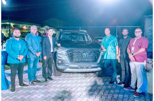 Minister of Public Works Bishop Juan Edghill near the Changan Hunter vehicle, with Managing Director of ANSA McAl, Troy Cadogan; Ansa Motors General Manager, Sudesh Mahase; Sales Manager, Yoganand Singh; and Commercial Counsellor at the Embassy of the People’s Republic of China, Li Hanquing, and Senior Director of Investment at the Guyana Office for Investment (GO-Invest), John Edghill (Delano Williams Photo)