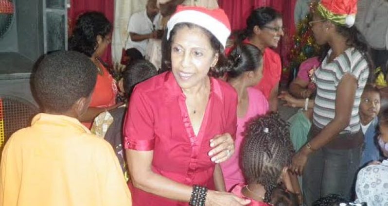 First Lady Deolatchmie Ramotar interacting with children at the party at Charity on Thursday
